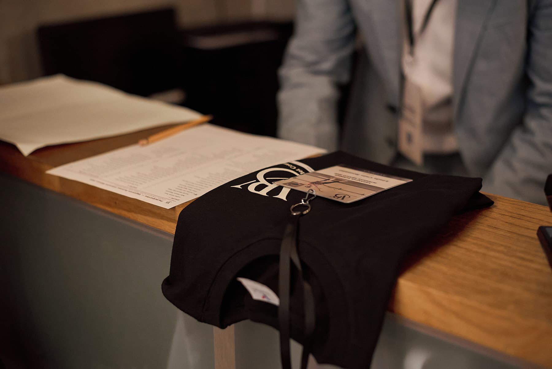 Check-in desk with T-shirt and badge